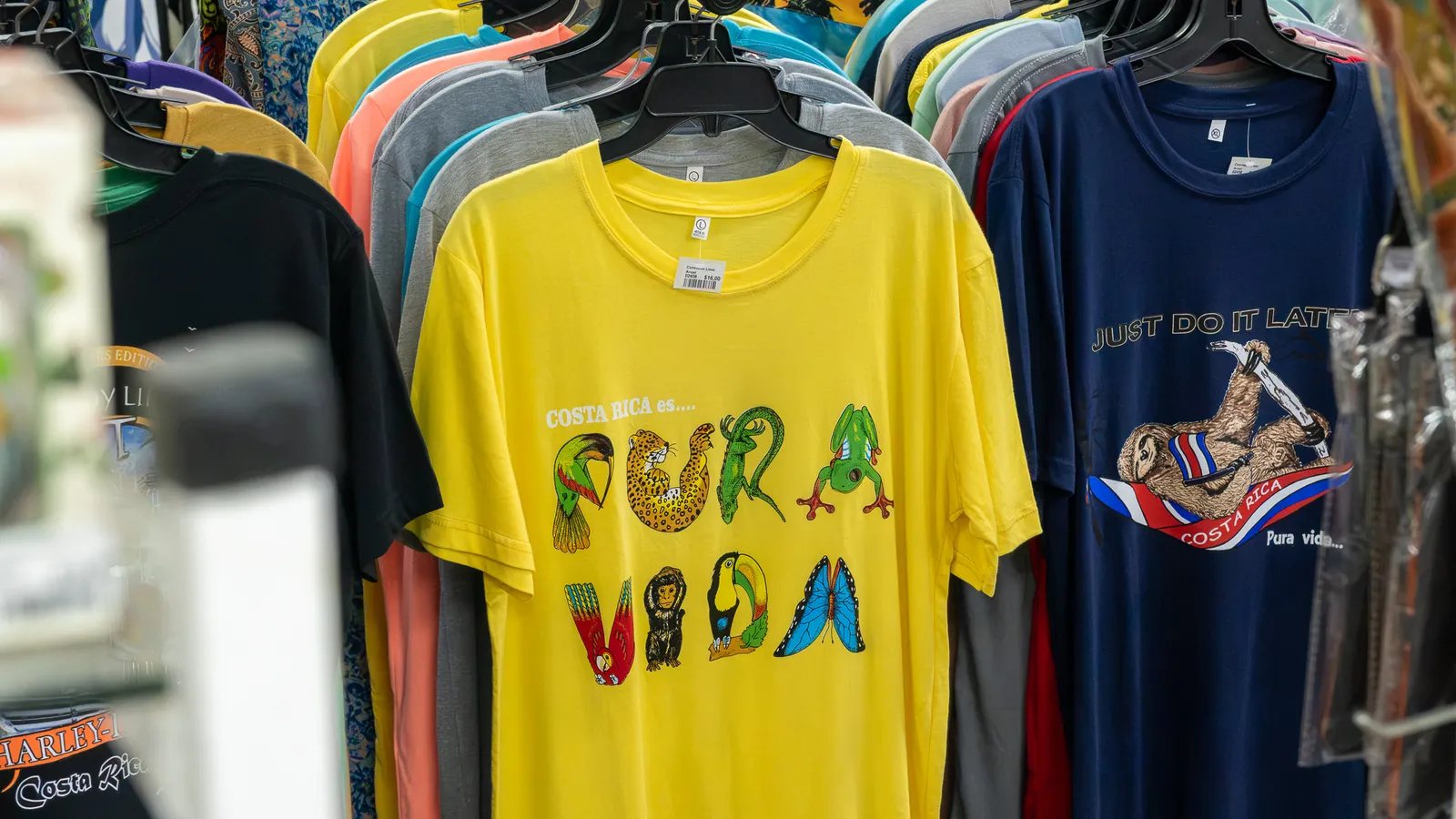 T-shirts with “Pura Vida” and sloth designs