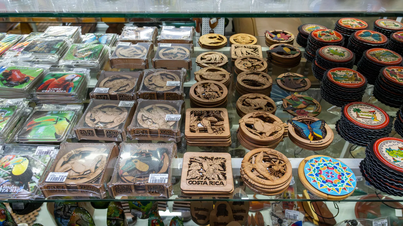Carved wooden coasters with Costa Rican wildlife