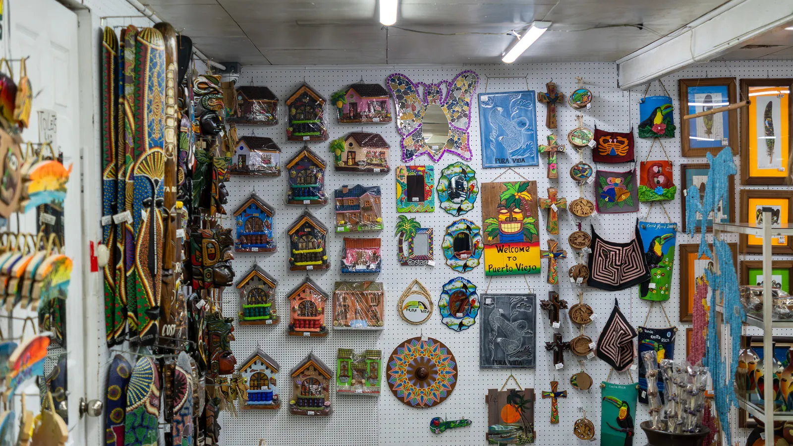 Wall of pictures, little wooden houses and colorful decorations