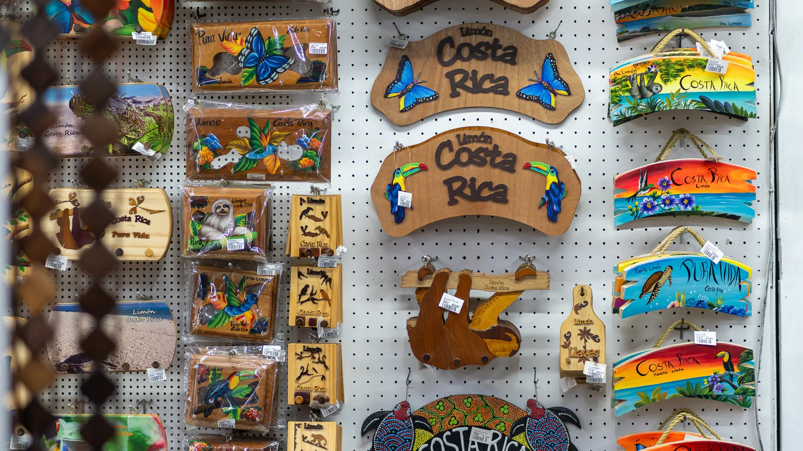 Wooden Costa Rica signs with butterflies and toucans