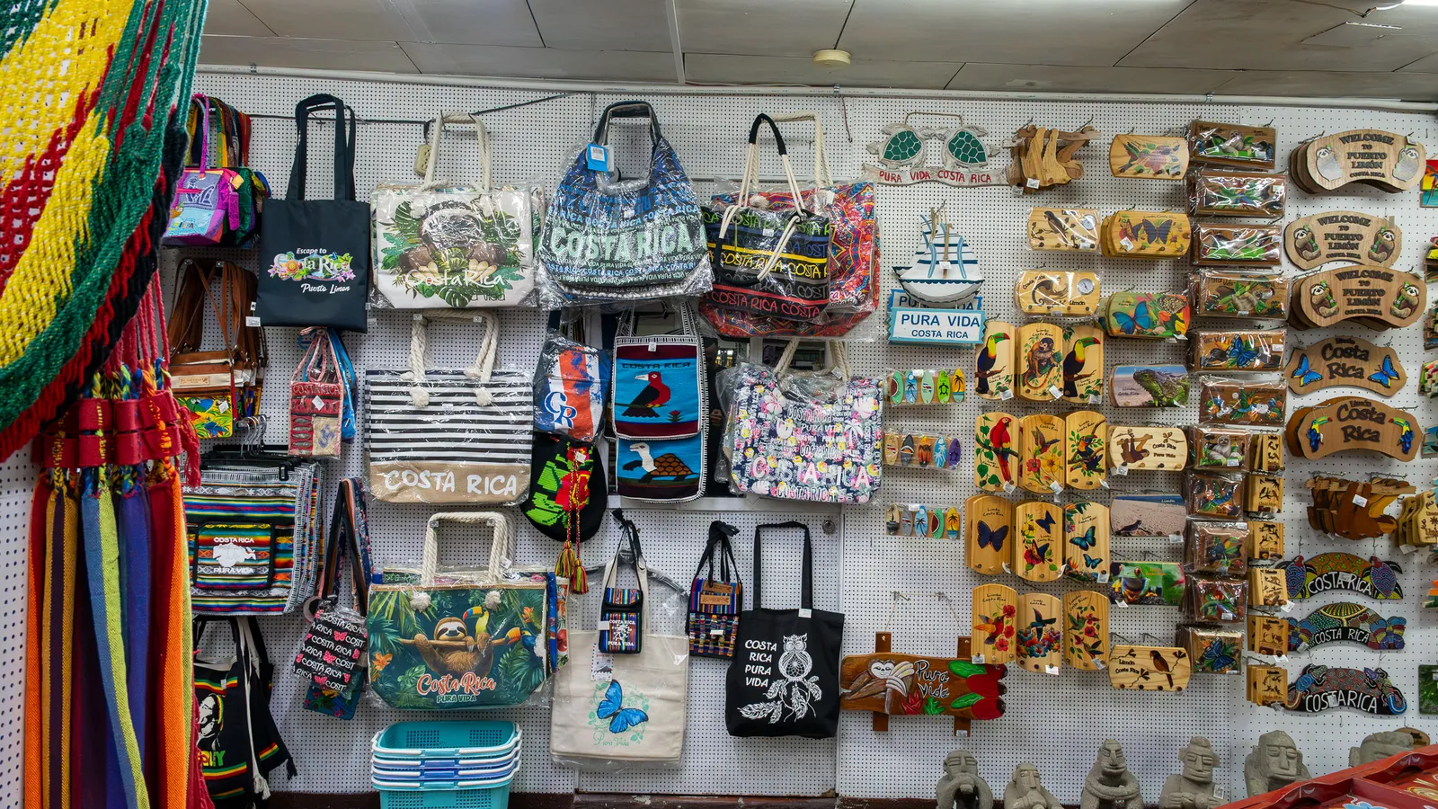 Hammocks, fabric bags and wooden keychains on the wall