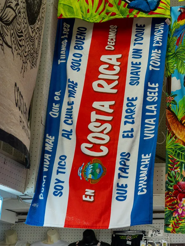 Beach towel with the Costa Rican flag and local sayings